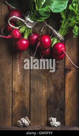 Fresh radish banches on wooden tray background, copy space Stock Photo