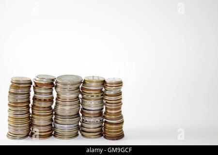 Five piles of coins Stock Photo