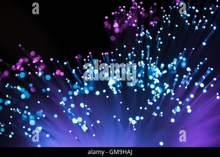 Bunch of glowing fiber optic cables Stock Photo