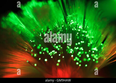 Bunch of glowing red and green fiber optic cables Stock Photo