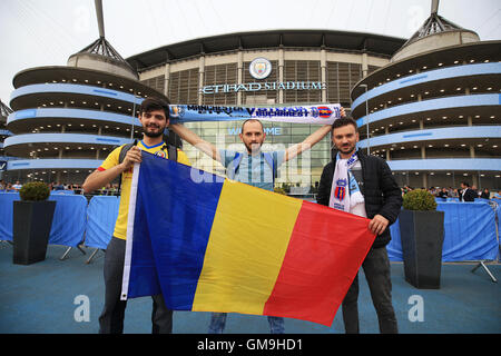Steaua Bucharest fans outside the stadium before the UEFA Champions League Play-off, Second Leg match at the Etihad Stadium, Manchester. Stock Photo