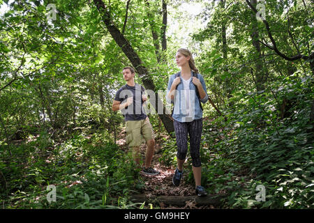 Couple hiking in forest Stock Photo