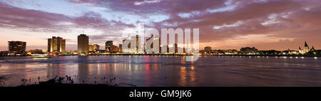 Louisiana, New Orleans, Mississippi river and city skyline with skyscrapers at sunset Stock Photo