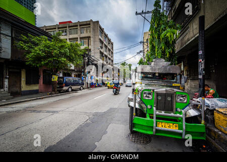 Street and jeepney in Sampaloc, Manila, The Philippines. Stock Photo