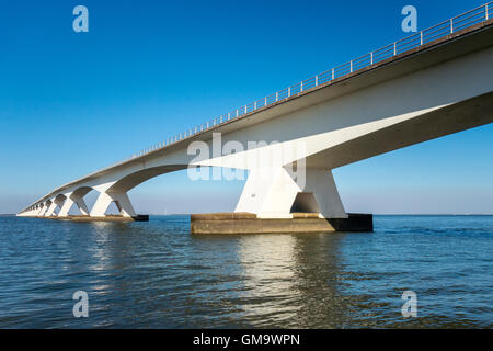 The Zeeland Bridge (Dutch: Zeelandbrug) is the longest bridge in the Netherlands. It spans the Oosterschelde estuary. Stock Photo