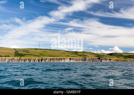 A view of Ceredigion coastal path from the sea, with Blaenplwyf broadcasting mast in the background Stock Photo