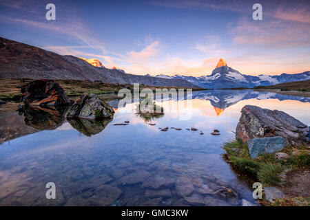 Matterhorn reflected in Lake Stellisee at dawn Zermatt Canton of Valais Pennine Alps Switzerland Europe Stock Photo