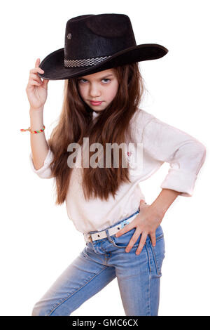 Portrait of a beautiful little girl in a black cowboy hat, studio on white isolated background Stock Photo