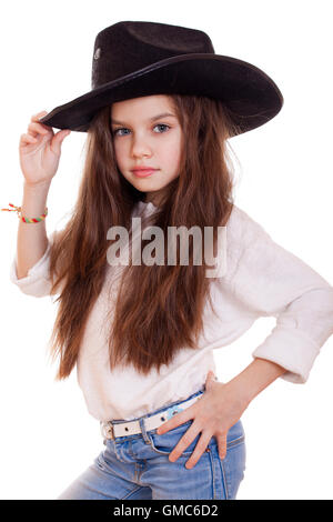 Portrait of a beautiful little girl in a black cowboy hat, studio on white isolated background Stock Photo