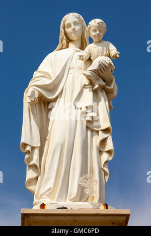 Statue of Mary holding baby Jesus, Punta Secca, Santa Croce Camerina, Sicily, Italy Stock Photo