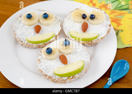 Owl cakes for kids breakfast on a plate. Funny creative food for healthy children breakfast. Stock Photo