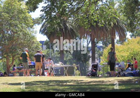 Local people enjoy BBQ at Flagstaff Gardens in Melbourne Australia. Stock Photo
