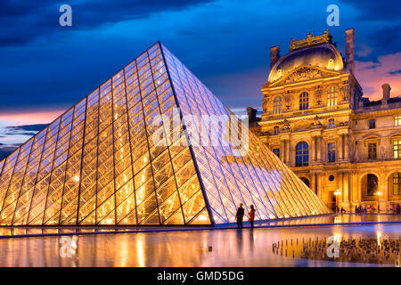 Twilight in the courtyard of Musee du Louvre, Paris, France Stock Photo