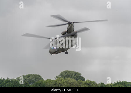 Royal Air Force Chinook twin rotor helicopter from RAF Odiham in Hampshire displays at the 2016 Royal International Air Tattoo Stock Photo