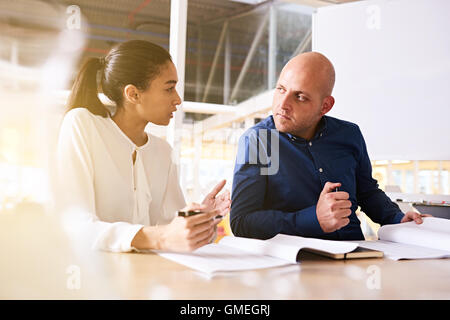 business meeting between male and female in modern bright offices Stock Photo