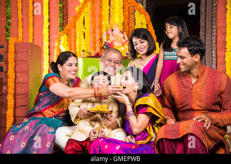 group photo of cheerful indian family in ganesh festival, happy indian family and ganpati festival Stock Photo