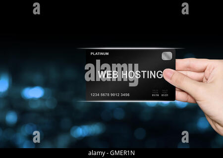 hand picking web hosting platinum card on blur background Stock Photo