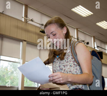 Southport, Merseyside. 25 Aug 2016. Anne Hart a  pupil from 'Christ The King Catholic High School' in Southport, celebrates her top ten stasr GCSE results with her parents.  After a long summer waiting for today the relief was evident as students ripped open their envelopes. Credit:  Cernan Elias/Alamy Live News Stock Photo