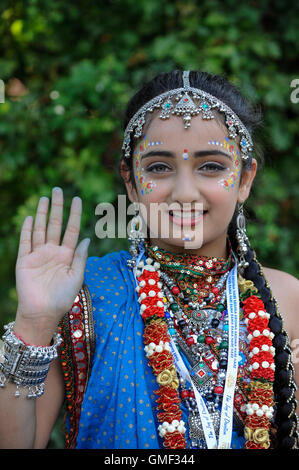 London, UK.  25 August 2016. A girl dressed as Rahda, Lord Krishna's consort, as thousands attend the biggest Janmashtami festival outside of India at the Bhaktivedanta Manor Hare Krishna Temple in Watford, Hertfordshire.  The event celebrates the birth of Lord Krishna. Credit:  Stephen Chung / Alamy Live News Stock Photo