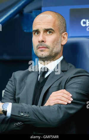 Manchester City manager Josep Guardiola, right, shake hands with ...