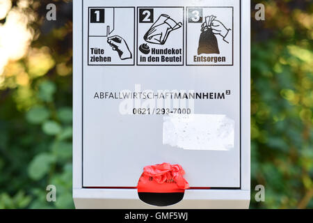 Mannheim, Germany. 24th Aug, 2016. A dog-excrement-bag dispenser stands in a park in Mannheim, Germany, 24 August 2016. Photo: Uwe Anspach/dpa/Alamy Live News Stock Photo