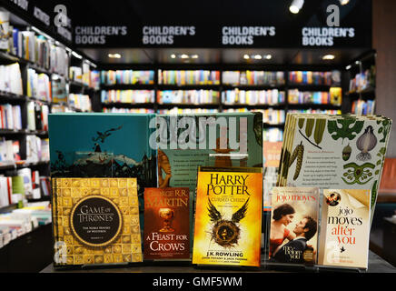 Berlin, Germany. 25th Aug, 2016. ILLUSTRATION - A big selection of books in English language, such as those from the 'Game of Thrones' series 'Harry Potter and the Cursed Child Parts I & II' by Joanne K. Rowling and books by Jojo moyes, are on sale at the 'English Bookshop' of culture department store Dussmann in Berlin, Germany, 25 August 2016. More and more readers choose the original versions of the books in English. Photo: Jens Kalaene/dpa/Alamy Live News Stock Photo