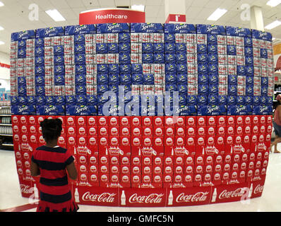 Westbury, New York, USA. 26th Aug, 2016. Hofstra Debate 2016 excitement seems inspiration for large Coca-Cola display in patriotic red white and blue, made of Coke, Sprite Zero, and Diet Coke soda 12-packs, that young girl is looking at in Target store in Westbury, only 3 miles away from Hofstra University, which is hosting the first Presidential Debate in exactly one month on September 26, 2016. © Ann Parry/ZUMA Wire/Alamy Live News Stock Photo