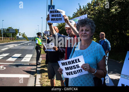 Prague, Czech Republic. 25th Aug, 2016. Demonstrators protest as Angela Merkel visits Prague. © David Tesinsky/Svobodne Forum/ZUMA Wire/Alamy Live News Stock Photo