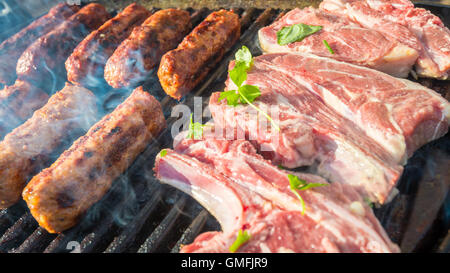 Delicious australian made chevapchichi sausage rolls and stakes cooked on BBQ Stock Photo
