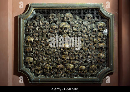 Human skulls and bones in the ossuary in the Church of San Bernardino alle Ossa in Milan, Lombardy, Italy. Stock Photo