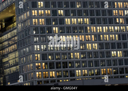 illuminated windows of an office building at night Stock Photo