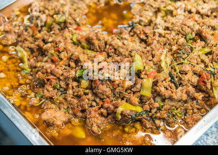 Close up Rice topped with stir fried pork and basil Stock Photo