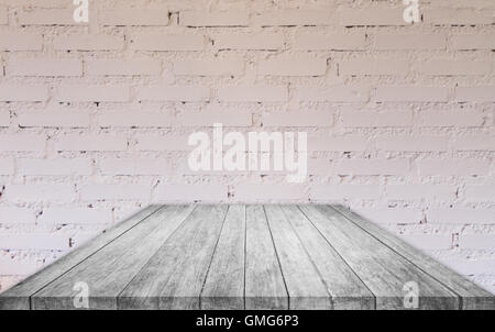 Perspective black and white wooden table top with brick wall decorated in coffee shop Stock Photo