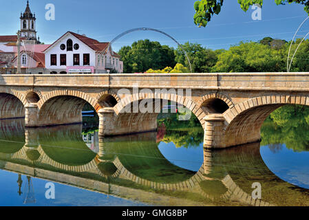 Portugal, Minho: Medieval bridge reflecting in the water of river Lima in Arcos de Valdevez Stock Photo