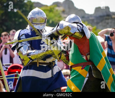 A Tudor knight in full armour carrying a poleaxe Stock Photo: 115913654 ...