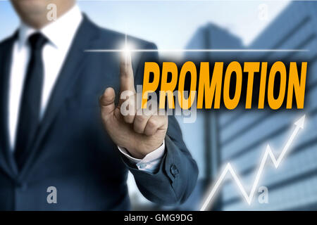 Promotion touchscreen is operated by businessman. Stock Photo