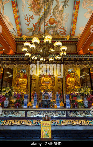 Buddha statues and altar at the Main Shrine Hall of Buddha at the Po Lin Monastery on Lantau Island in Hong Kong, China. Stock Photo
