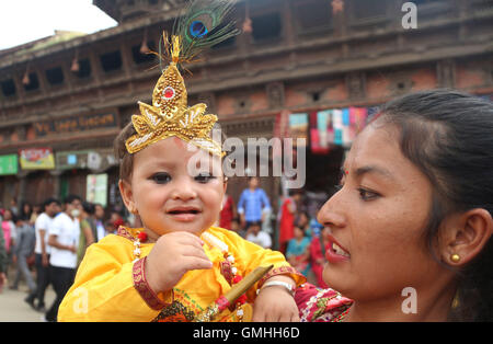 Lalitpur, Nepal. 25th Aug, 2016. A boy dressed up as Lord Krishna smiles during celebrations of Krishna Janmasthami at Patan durbar square in Lalitpur, Nepal. Krishna Janmasthami marks the birthday of Lord Krishna. © Archana Shrestha/Pacific Press/Alamy Live News Stock Photo