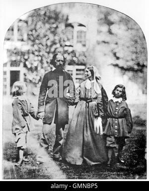 ALFRED TENNYSON (1809-1892) English poet with his family at their home Farringford House in Freshwater Bay on the Isle of Wight in 1862. From left: Lionel, Tennyson, wife Emily, Hallam. Photo Oscar Rejlander Stock Photo