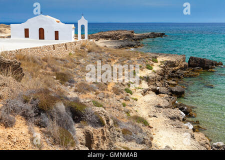 Agios Nikolaos. White Orthodox church on the Sea. Rocky coast of island Zakynthos, Greece Stock Photo