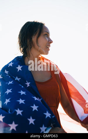 Smiling woman with wet hair and american flag Stock Photo