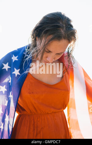 Smiling woman with wet hair and american flag Stock Photo