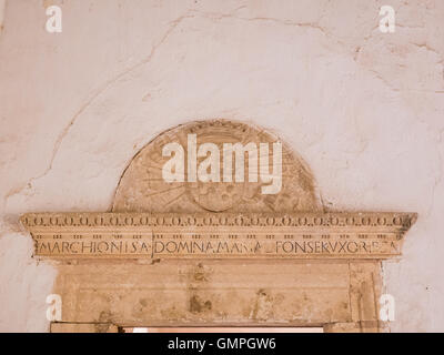 An Italian Renaissance decoration above a lintel with Latin inscription at Castle La Calahorra. Stock Photo