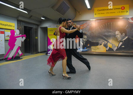 Buenos Aires, Argentina - 22 Aug 2016: Couple performs during the Tango Buenos Aires Festival in the subway station. Stock Photo