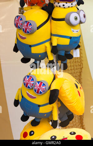 Minions soft cuddly toys to win on fairground stall Stock Photo