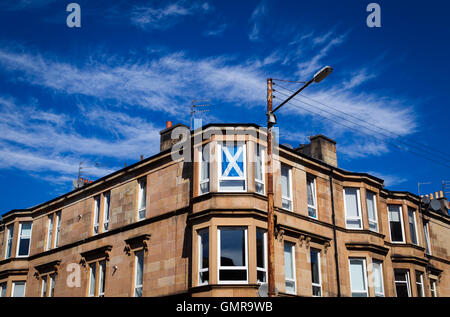 Glasgow tenement flat with Saltire flag in window. Stock Photo