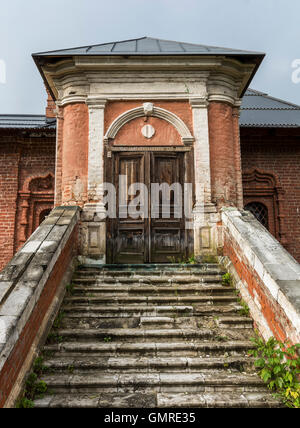 The door in an old house with a ladder Stock Photo