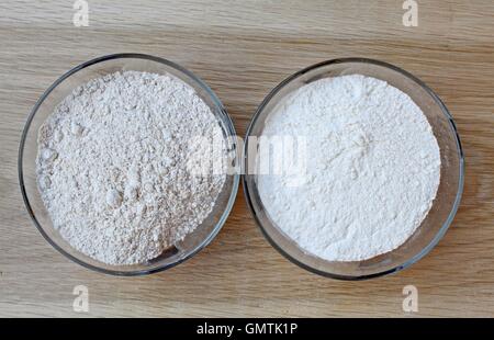 Two types of flour in wooden bowls Stock Photo