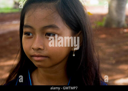 A young Khmer girl is posing for a portrait in Chork village, Cambodia ...