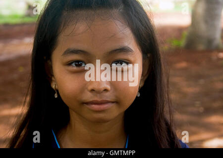 Khmer Cambodian School Girl Outside Traditional School In Southern 